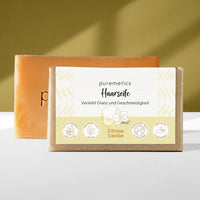 Haarseife von Puremetics, natürliche Beauty- und Pflegeprodukt, zeigt die Seife in einer weißen Verpackung mit grüner Beschriftung