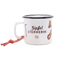Emailletasse von Roadtyping, robuster Becher für drinnen und draußen, zeigt das Roadtyping-Logo auf weißem Hintergrund.