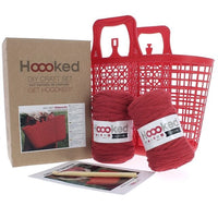 Häkelset von Hoooked für Shopper in Lippenstiftrot, enthält Häkelnadel und bunte Wolle für DIY-Handarbeit.