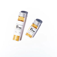 Goldene Glitzer-Bio 5g von Birkenspanner, beauty und Pflege, zeigt die funkelnde Verpackung und Produkttextur.