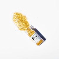Goldene Glitzer-Bio 5g von Birkenspanner, elegant Verpackung, für Beauty und Pflege, schimmerndes Produkt in kleiner Dose.