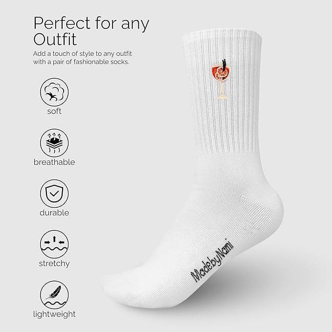 Bunte Socken von Made By Nami mit Aperol-Motiv, aus weicher Bekleidung, zeigen ein lebendiges Design auf weißem Hintergrund