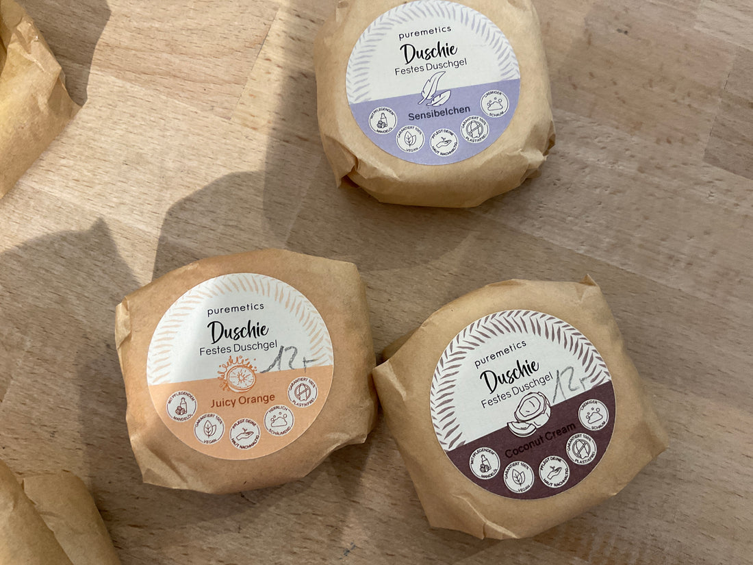 Duschie Beauty & Pflege Produkt von Puremetics, zeigt eine stilvolle Verpackung für Hautpflege und Wellness.