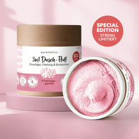 Dusch-Fluffs von Puremetics, 3-in-1 Körperpflege, weiche Textur für Reinigung und Pflege, auf einem weißen Hintergrund.