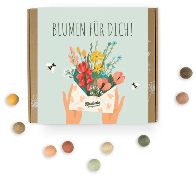 Blossombs Geschenk-Box Mittel für drinnen und draußen, mit bunten Blumenmotiven auf der Verpackung.
